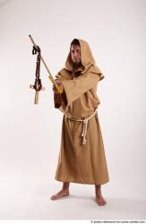 JOEL_ADAMSON STANDING POSE WITH SWORD AND CRUCIFIX